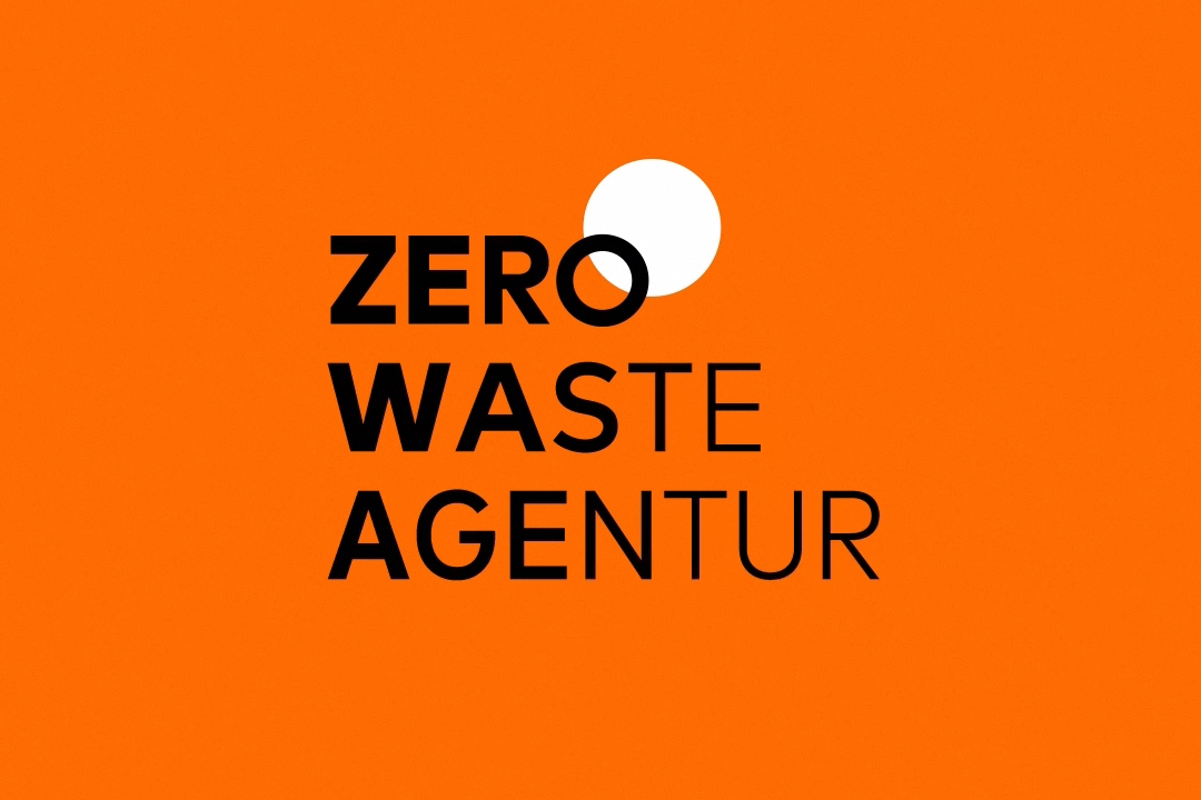 logo zero waste agentur black type orange background